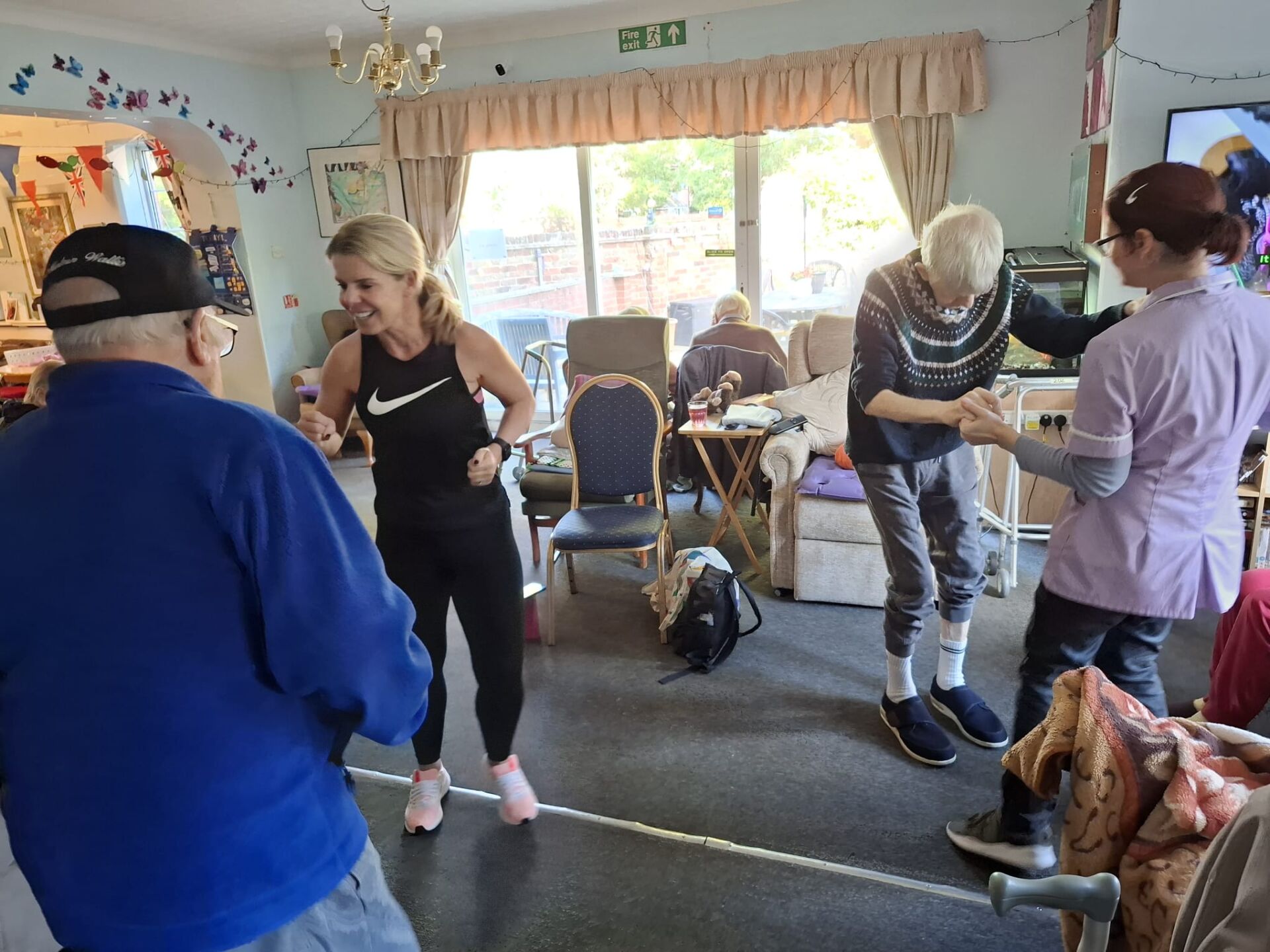 Residents dancing with carers